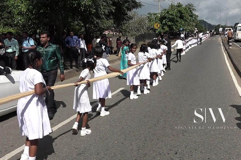 Sri Lankan Bride's 3.2km Train Carried by School-Children